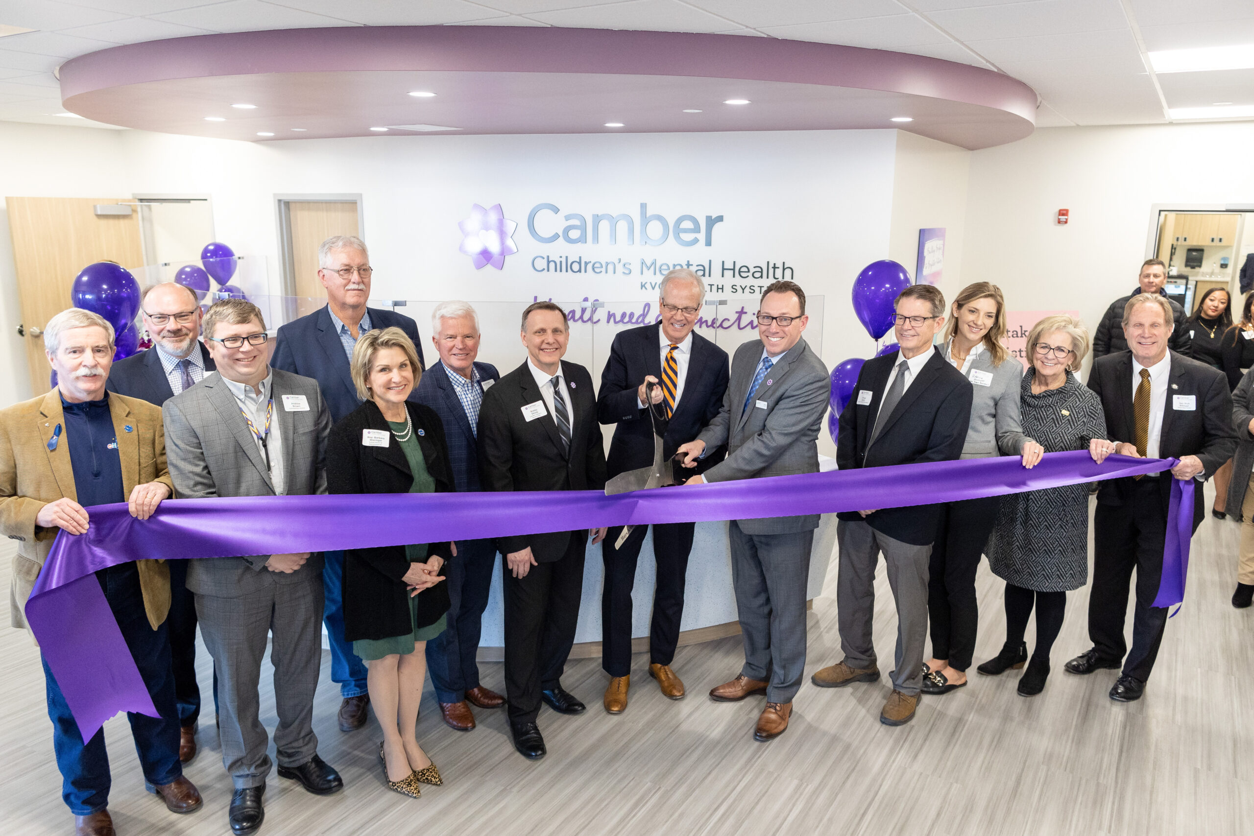 Supporters and officials at the ribbon cutting ceremony of Camber Children's Mental Health in Hays, Kansas, an inpatient psychiatric and residential treatment center for youth