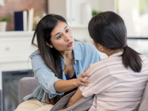 therapist talking to a child