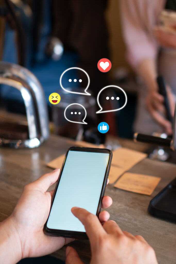 cell phone showing social media chatting, facebook, instagram, emojis 