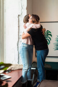 woman embracing and comforting a mother