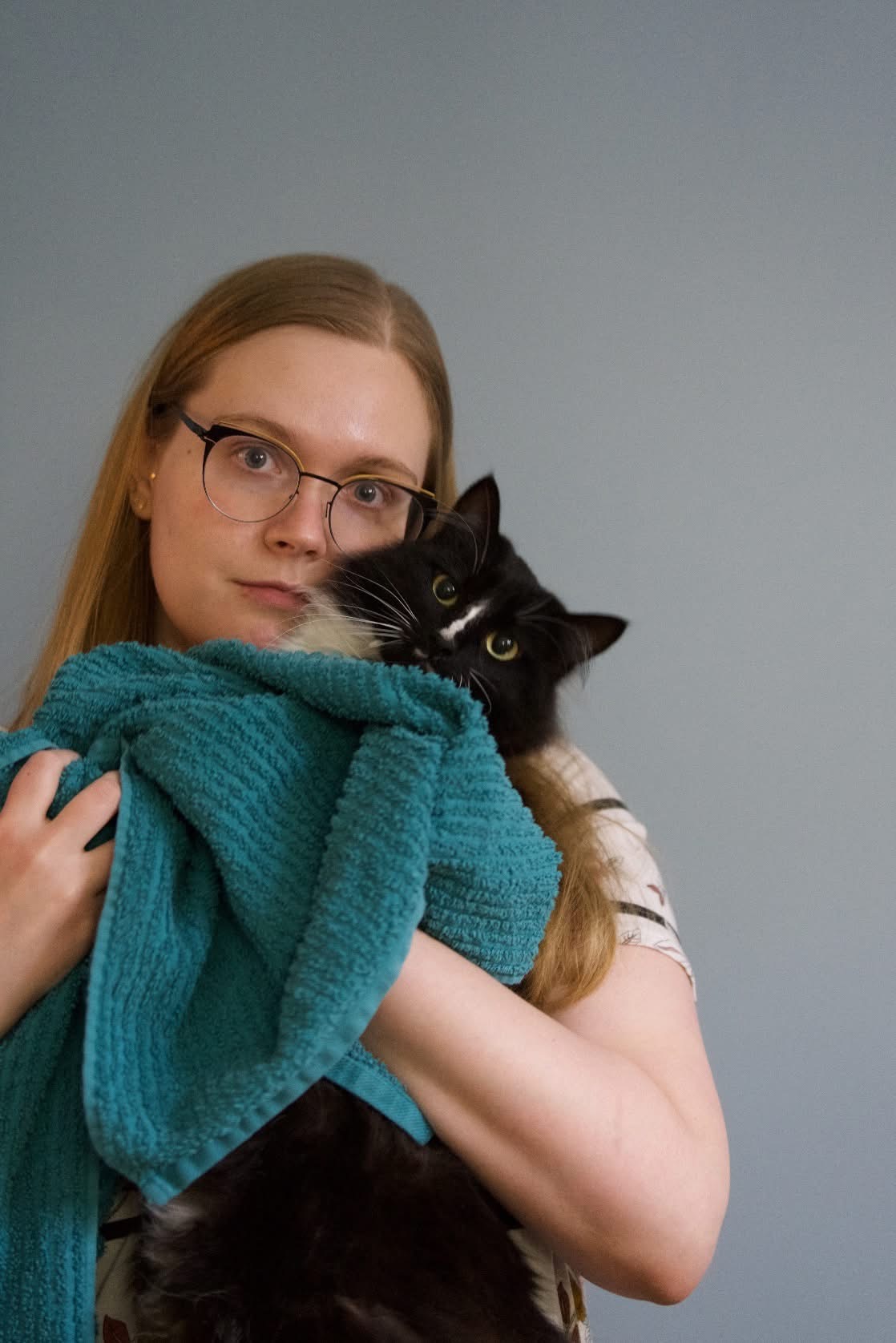 Holly, Marketing & Communications Coordinator and her cat, Tuna